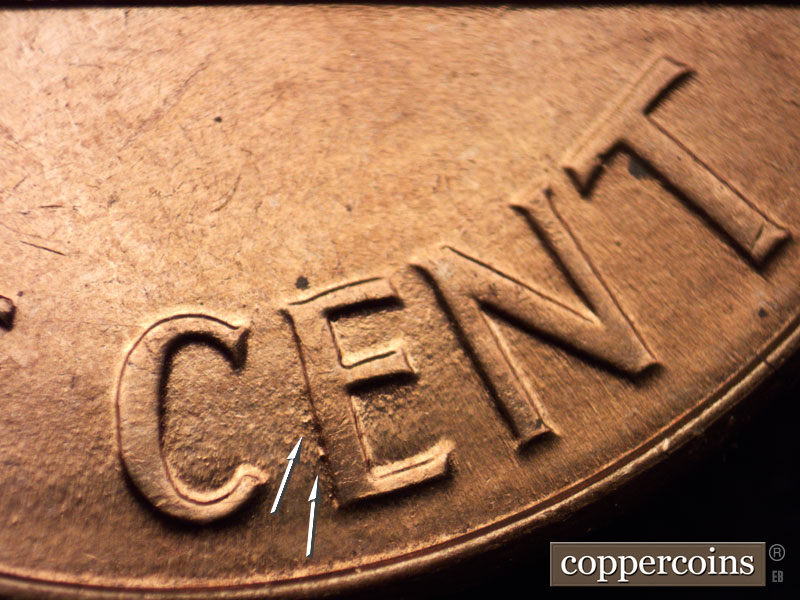 Die-stage C marker on 1960D•1MM•043 showing 2 die dots behind E in CENT.