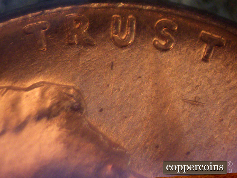 Die-stage B marker on 1960D•1MM•044 showing Die scratches under TRU in TRUST.