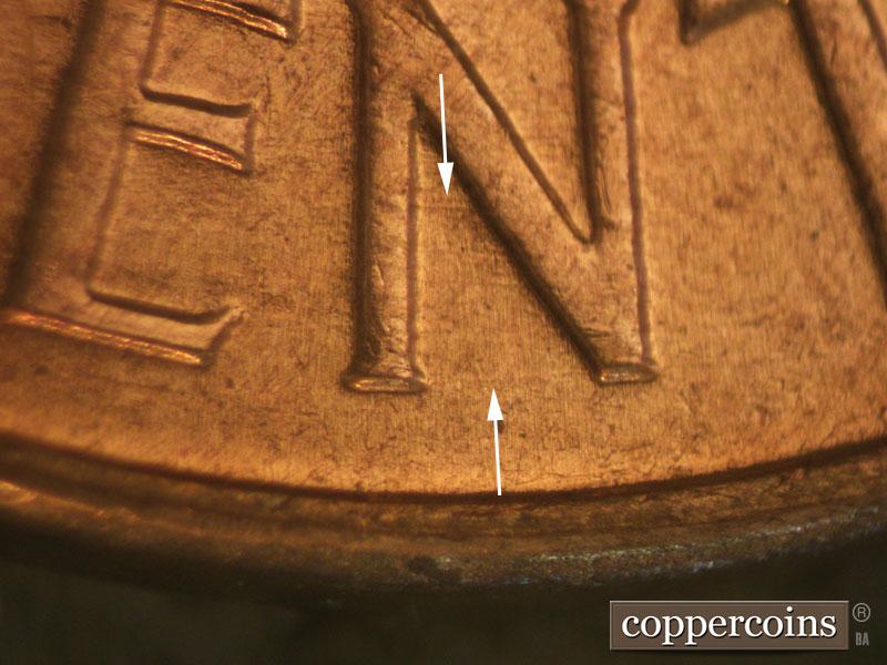 Die-stage B marker on 1960D•1MM•044 showing Light die scratches through N of CENT.