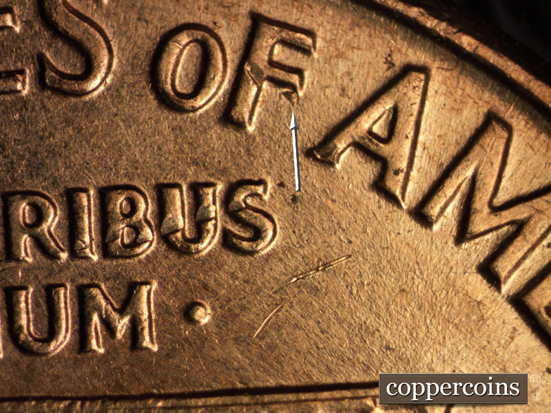 Die-stage A marker on 1960D•1MM•046 showing Die gouge on F in OF. No die break on column 12.