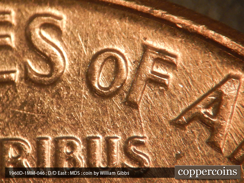 Die-stage B marker on 1960D•1MM•046 showing Heavy die scratch connect F in OF to S in PLURIBUS.