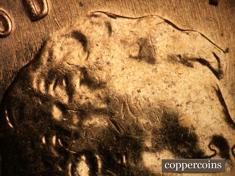 Die-stage A marker on 1960D•1MM•047 showing No die crack on forehead.