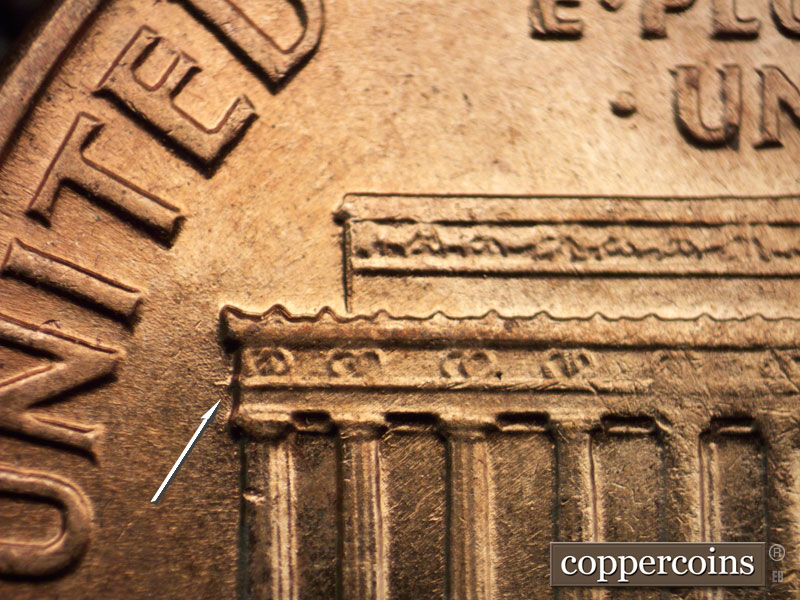 Die-stage C marker on 1960D•1MM•047 showing Small die gouge off left eave.