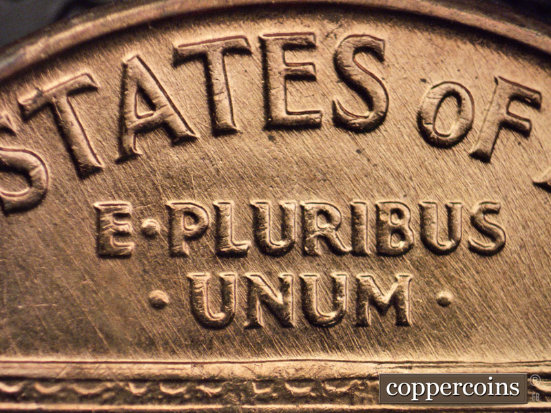 Die-stage A marker on 1960D•1MM•048 showing NNE die scratches from roof to rim through E PLURIBUS UNUM.