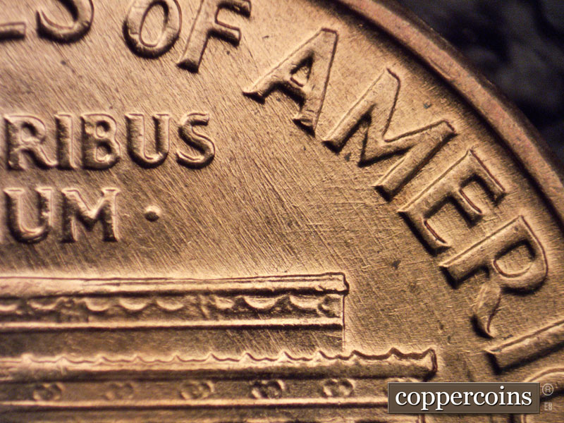 Die-stage A marker on 1960D•1MM•048 showing Crossed die scratches under ME in AMERICA.