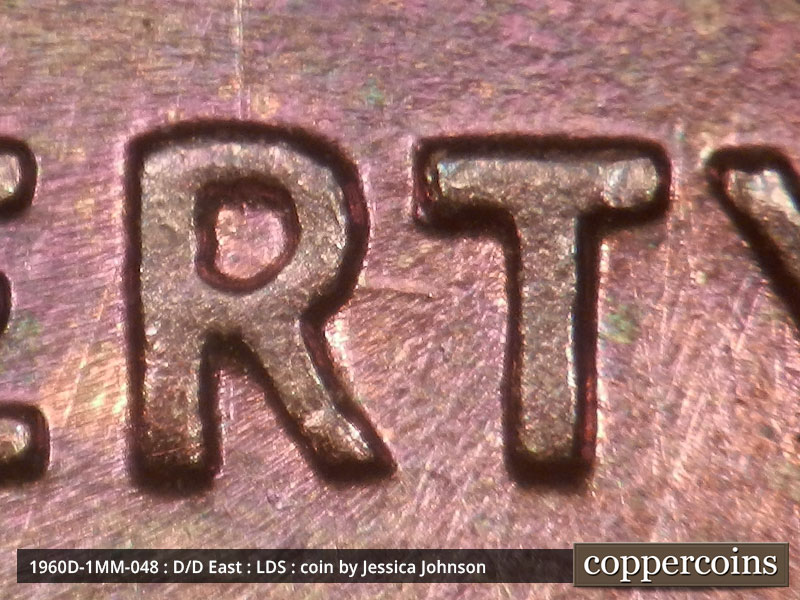 Die-stage C marker on 1960D•1MM•048 showing Die scratch between RT in LIBERTY.