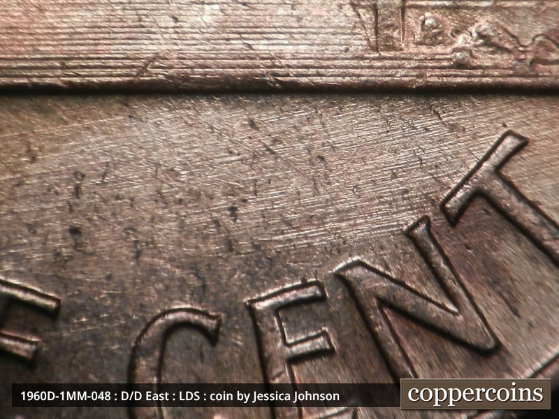 Die-stage C marker on 1960D•1MM•048 showing ENE die scratches in field near ONE CENT.