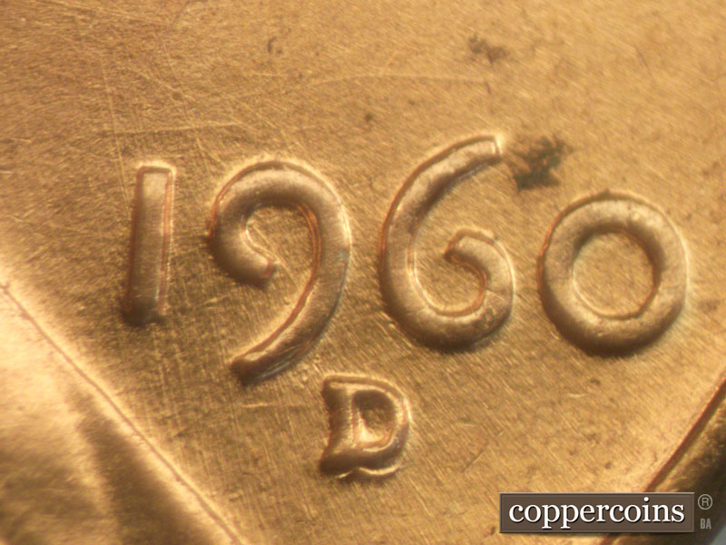 Die-stage B marker on 1960D•1MM•050 showing Multi directional die scratches show throughout date area.