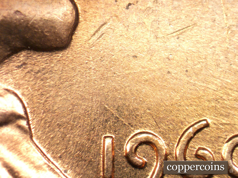 Die-stage C marker on 1960D•1MM•050 showing NW die scratch from top of 9 in date.