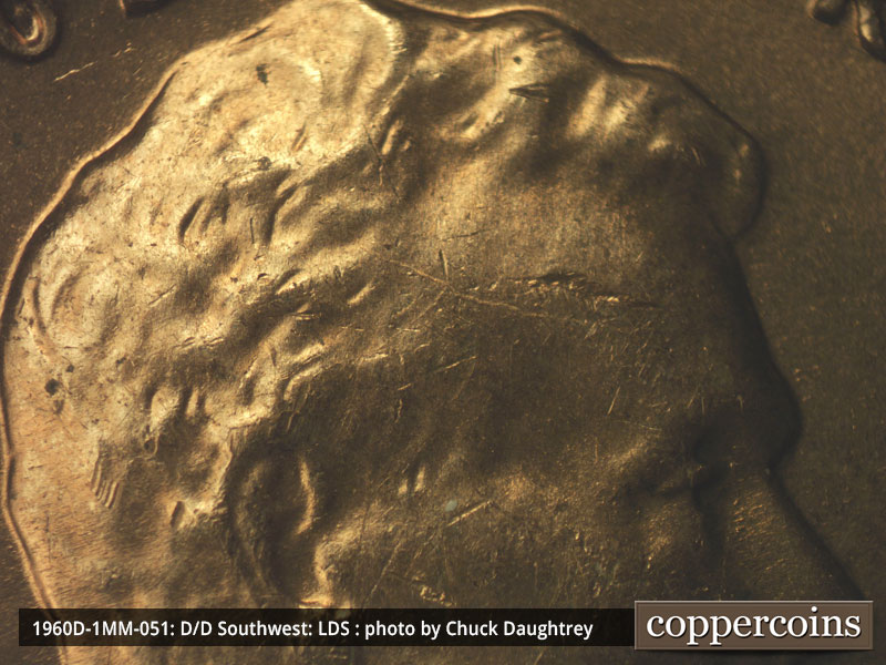 Die-stage C marker on 1960D•1MM•051 showing Die crack through forehead.