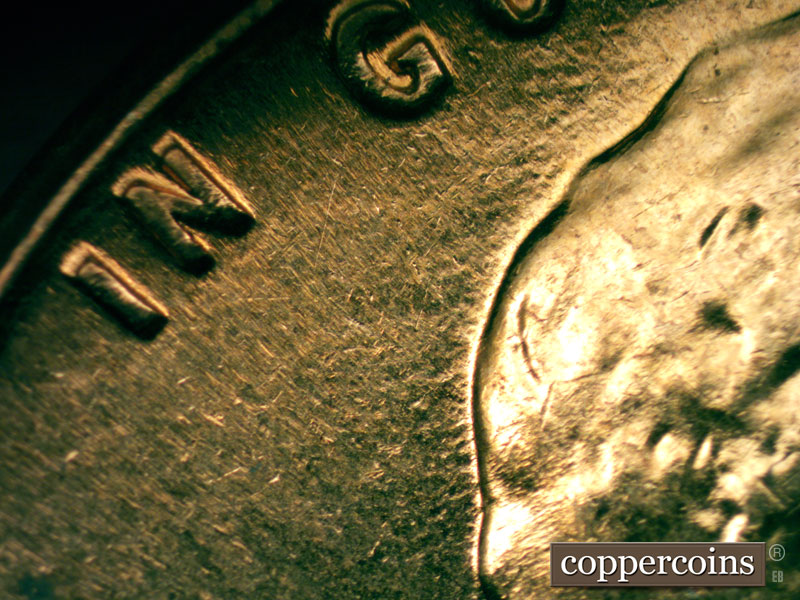 Die-stage C marker on 1960D•1MM•053 showing Die scratches worn away from previous stage.