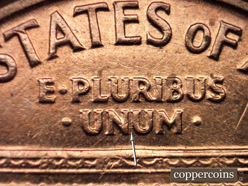 Die-stage B marker on 1960D•1MM•058 showing Short E/W die scratch between N and U in UNUM.
