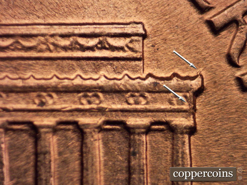 Die-stage B marker on 1960D•1MM•058 showing Die crack right cornice.