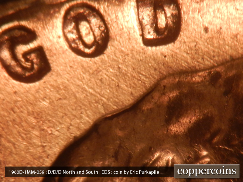 Die-stage A marker on 1960D•1MM•059 showing Die scratches run NW from the top of the head to GOD.