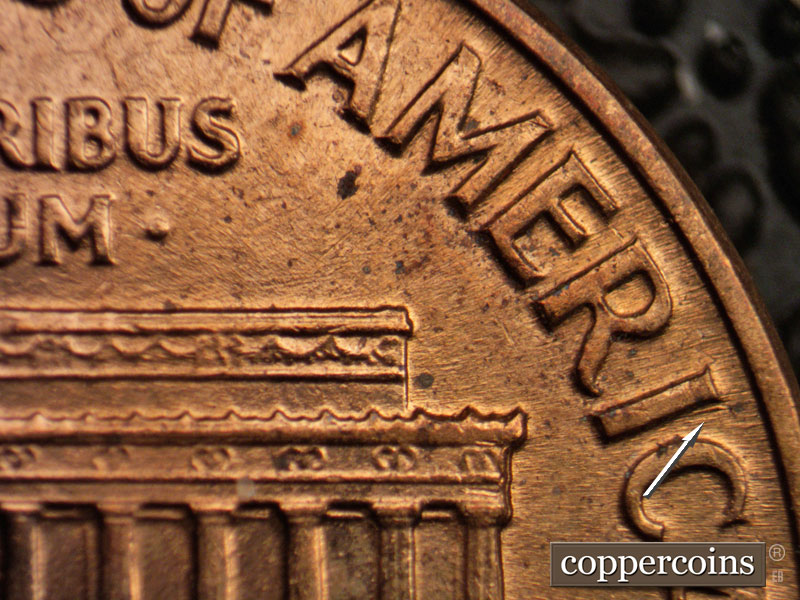 Die-stage B marker on 1960D•1MM•061 showing Heavy die gouge next to I in AMERICA.