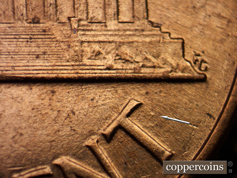 Die-stage B marker on 1960D•1MM•061 showing Die dot next to T in CENT.