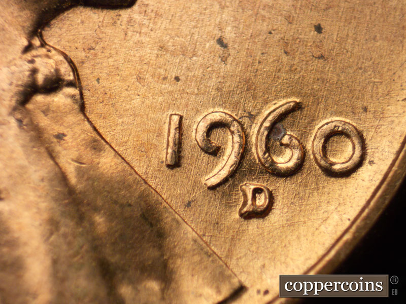 Die-stage A marker on 1960D•1MM•063 showing Crossing die scratches through date.