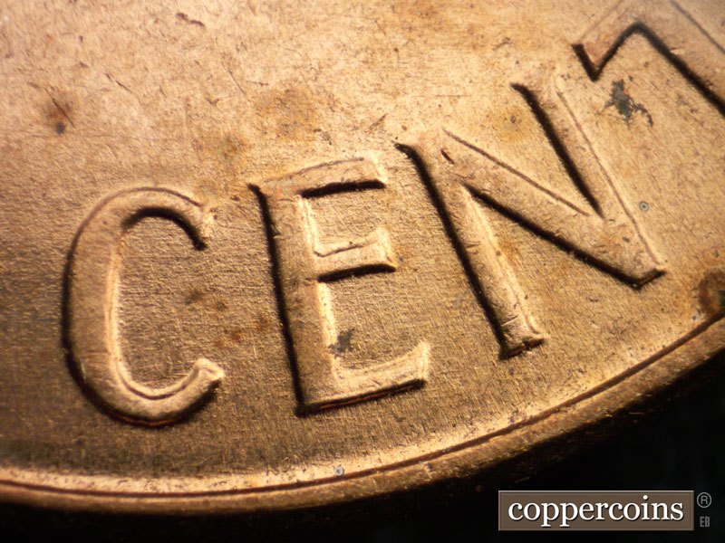 Die-stage A marker on 1960D•1MM•063 showing Light E/W die scratches through CENT.