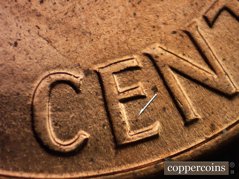 Die-stage A marker on 1960D•1MM•064 showing Die gouge in lower E in CENT.