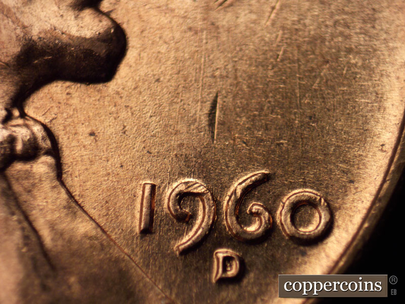 Die-stage B marker on 1960D•1MM•065 showing Two die scratches run N-S through the 9 in the date.