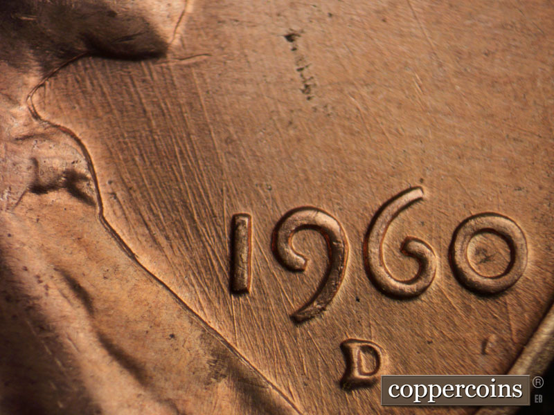 Die-stage C marker on 1960D•1MM•072 showing Multiple generally NNW die scratches through 19 in date.