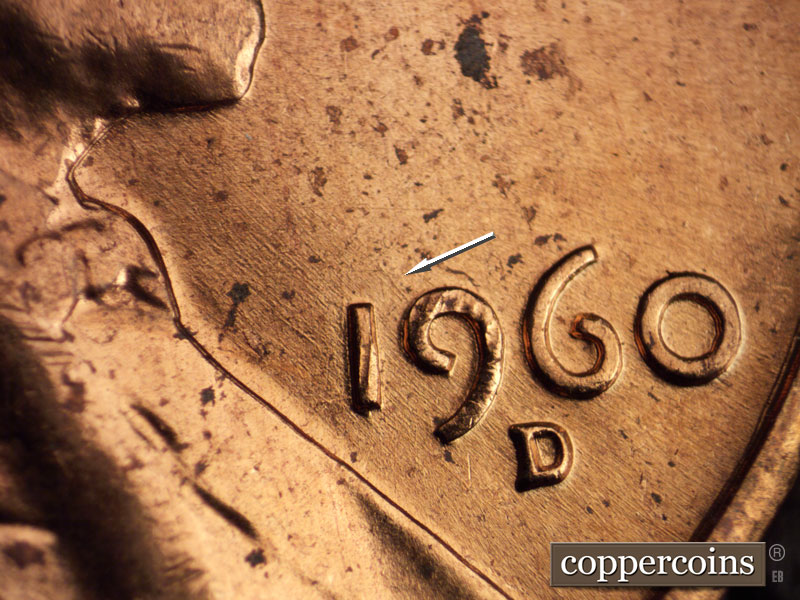 Die-stage A marker on 1960D•1MM•073 showing EW/SE die scratches through 19 of date.