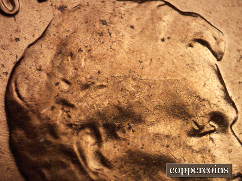 Die-stage B marker on 1960D•1MM•073 showing Light die crack on forehead.