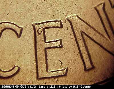 Die-stage C marker on 1960D•1MM•073 showing A die break shows on the upper E of CENT.
