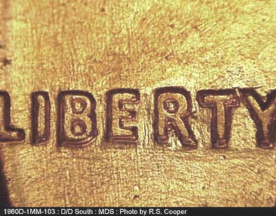 Die-stage B marker on 1960D•1MM•103 (1960 Repunched Mint Mark).