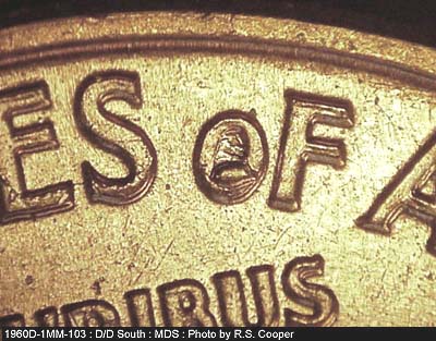 Die-stage B marker on 1960D•1MM•103 (1960 Repunched Mint Mark).