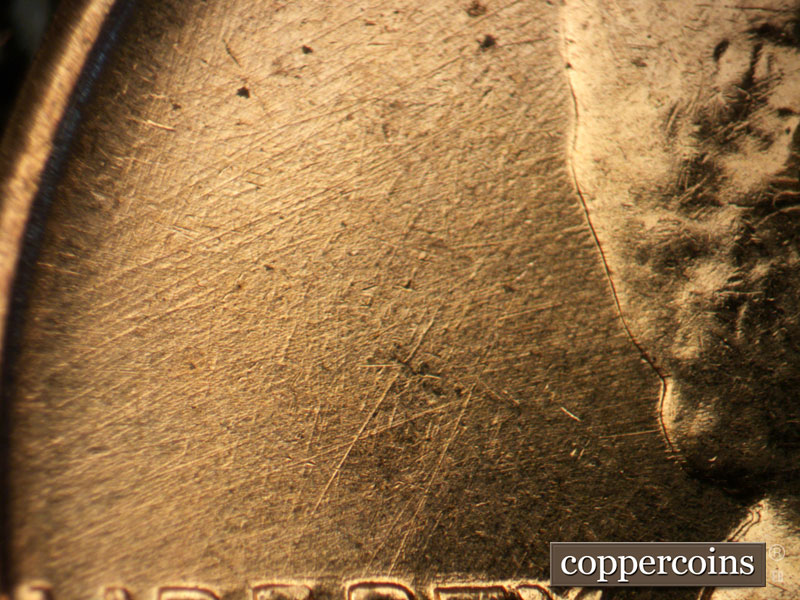 Die-stage B marker on 1960D•1MM•105 (1960 Repunched Mint Mark).