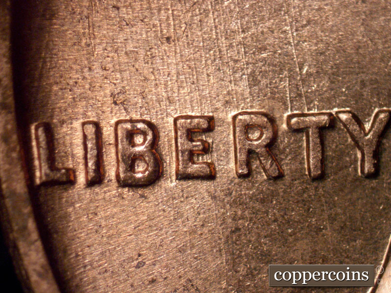 Die-stage B marker on 1960D•1MM•116 (1960 Repunched Mint Mark).
