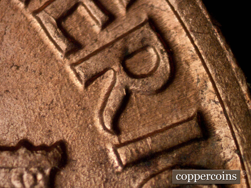 Die-stage B marker on 1960D•1MM•116 (1960 Repunched Mint Mark).