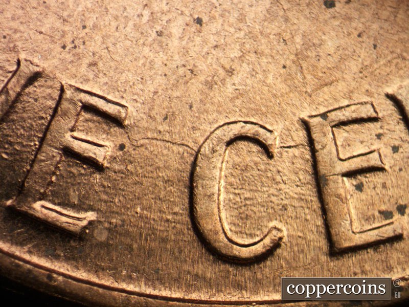 Die-stage A marker on 1960D•1MM•117 (1960 Repunched Mint Mark).