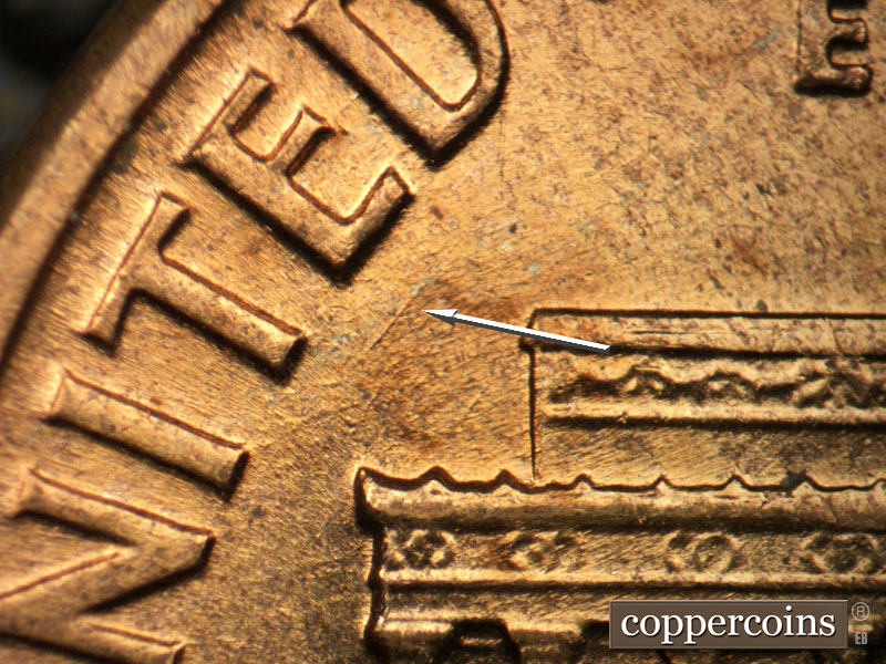 Die-stage B marker on 1960D•1MM•117 (1960 Repunched Mint Mark).