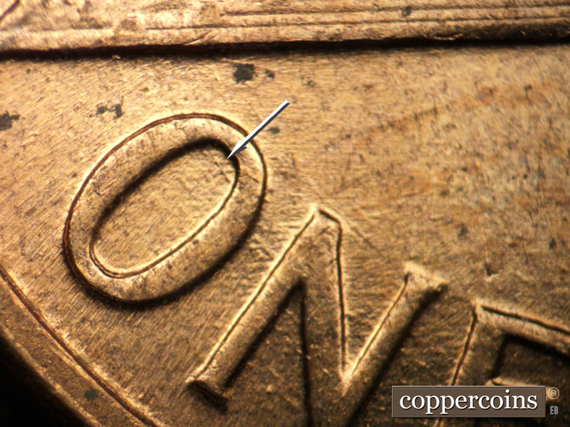 Die-stage B marker on 1960D•1MM•117 (1960 Repunched Mint Mark).