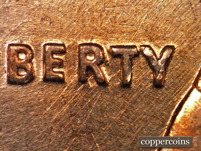 Die-stage B marker on 1960D•1MM•122 (1960 Repunched Mint Mark).