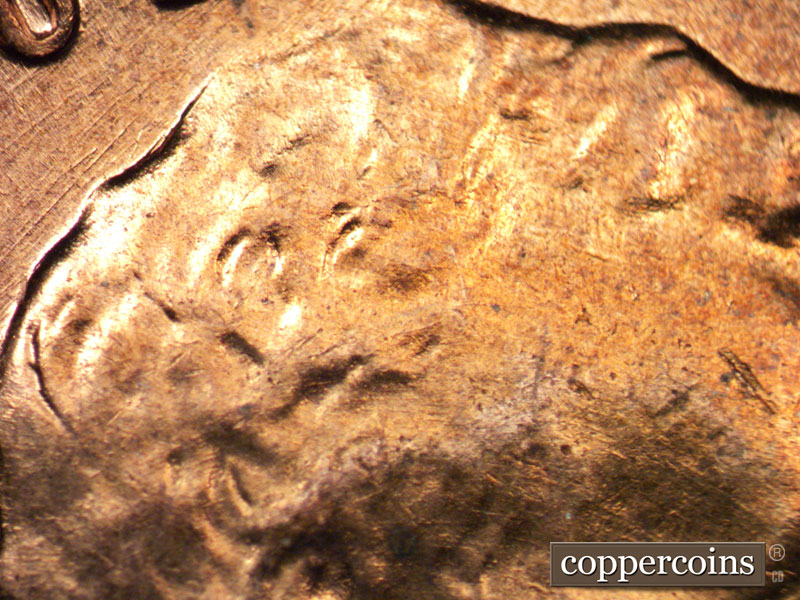 Die-stage B marker on 1960D•1MM•122 (1960 Repunched Mint Mark).