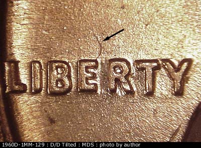 Die-stage B marker on 1960D•1MM•129 (1960 Repunched Mint Mark).