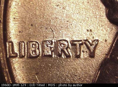 Die-stage B marker on 1960D•1MM•129 (1960 Repunched Mint Mark).