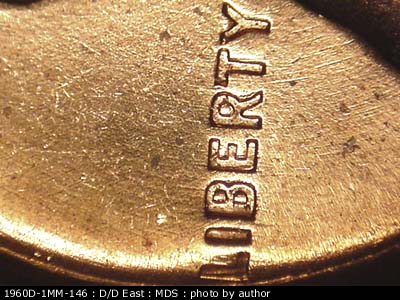 Die-stage B marker on 1960D•1MM•146 (1960 Repunched Mint Mark).