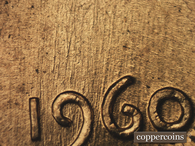 Die-stage B marker on 1960D•1MM•158 showing NNE die scratches through date.