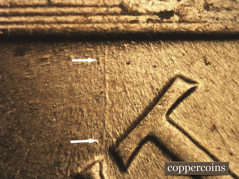 Die-stage B marker on 1960D•1MM•158 showing N/S die gouge from base to tip of N in CENT.