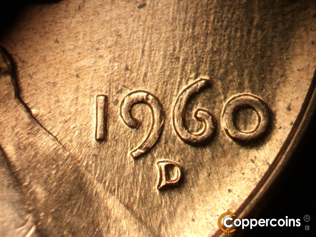 Die-stage C marker on 1960D•1MM•158 showing NNE die scratches through date.