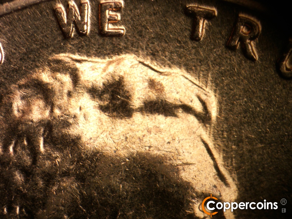 Die-stage C marker on 1960D•1MM•158 showing NNE die scratches still visible from stage B.