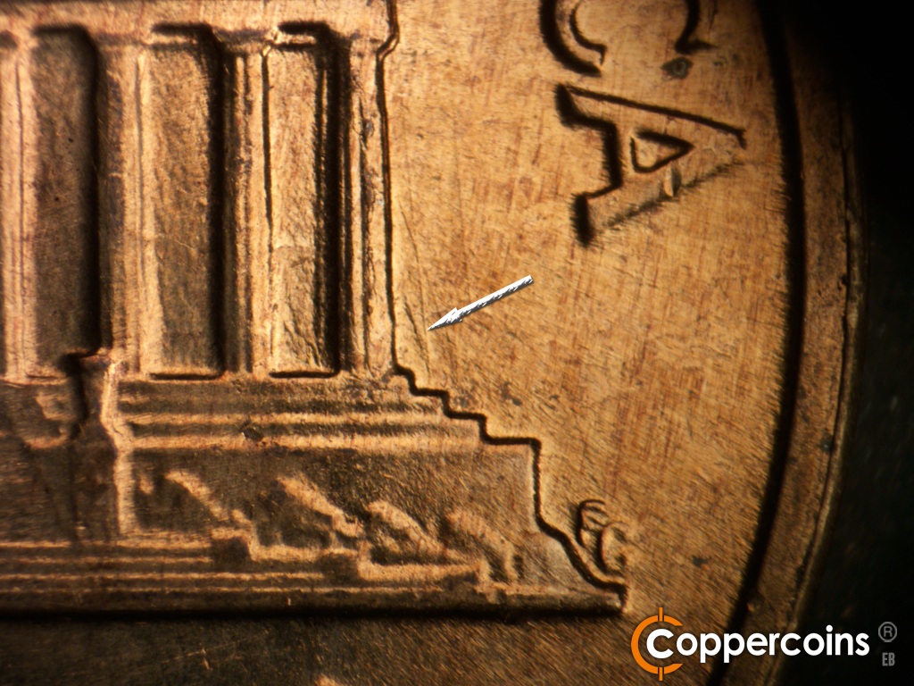 Die-stage C marker on 1960D•1MM•158 showing NW die scratch from top of right base tocoulumn 12. Die chippeing down column 12.