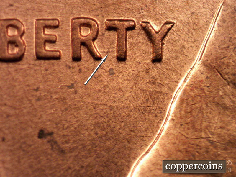 Die-stage C marker on 1960D•1MM•163 showing Worn E/W die scratch connects RT in LIBERTY.