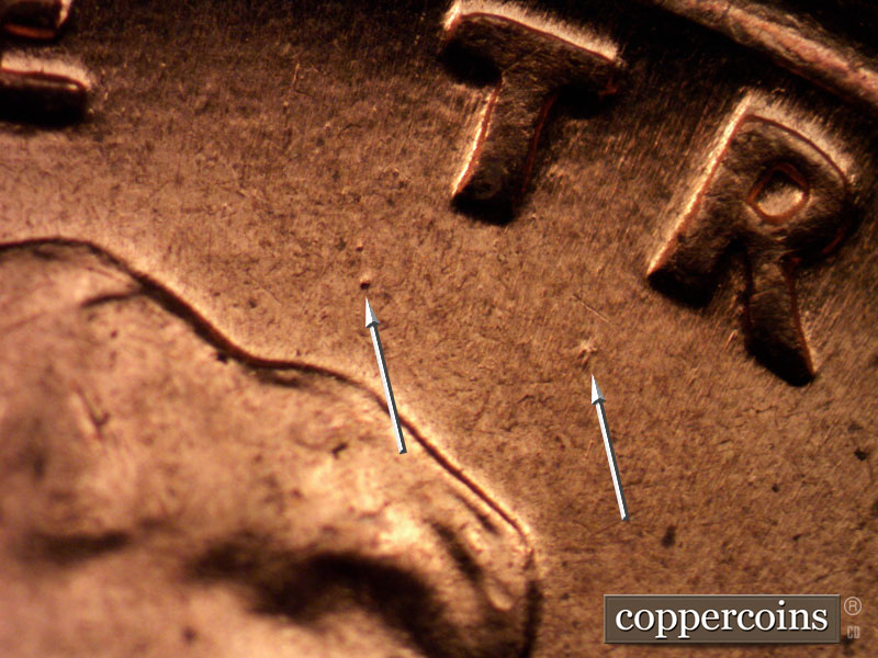 Die-stage C marker on 1960D•1MM•163 showing Die dots below TR in TRUST.
