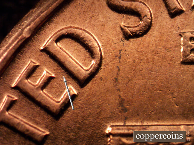 Die-stage C marker on 1960D•1MM•163 showing E/W die scratch through ED in UNITED.