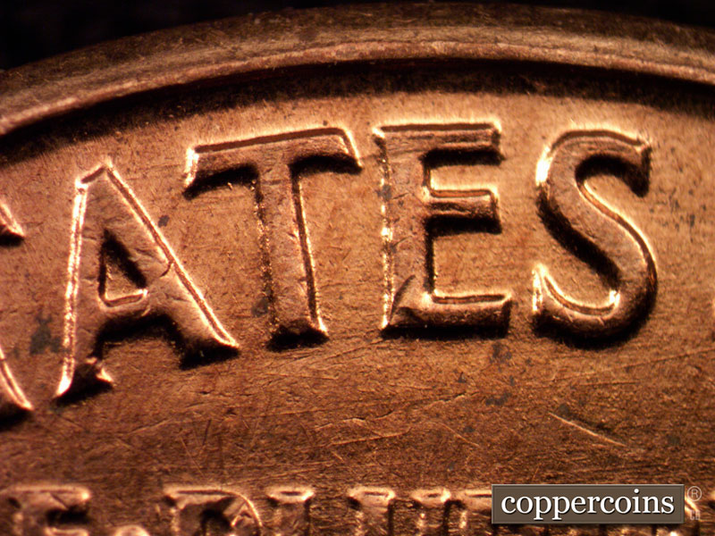 Die-stage C marker on 1960D•1MM•163 showing Die scratches under ATES in STATES.